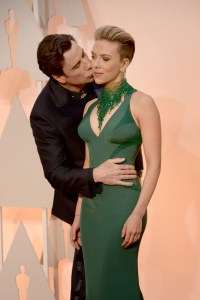 HOLLYWOOD, CA - FEBRUARY 22:  Actor John Travolta (L) and actress Scarlett Johansson attend the 87th Annual Academy Awards at Hollywood & Highland Center on February 22, 2015 in Hollywood, California.  (Photo by Kevin Mazur/WireImage)